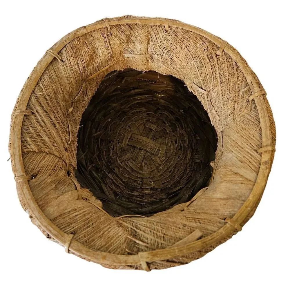 Primitive handmade basket, dried palm leaf woven.